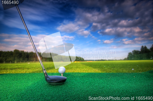 Image of Playing golf. Club and ball on tee