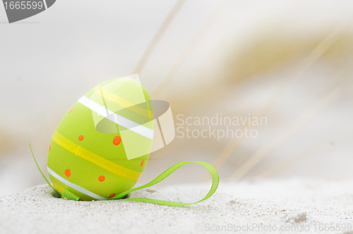 Image of Easter decorated egg on sand