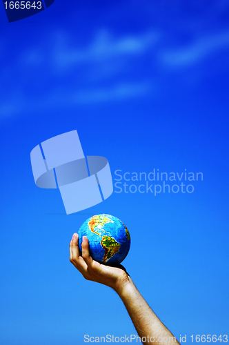 Image of Earth globe in hands. Conceptual image