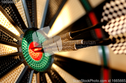 Image of Three arrows in the centre of a dart board