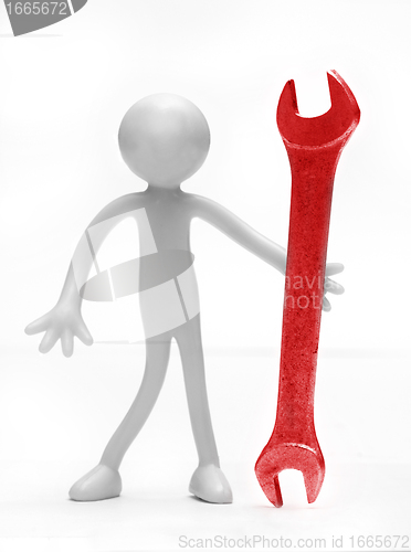 Image of Holding a wrench tool
