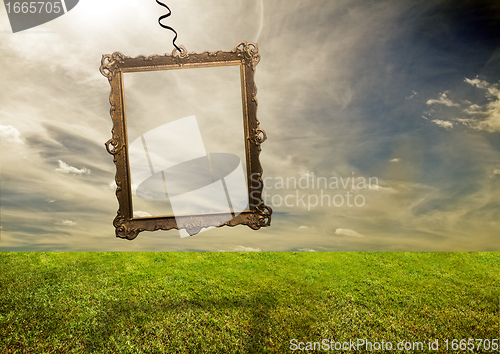 Image of Empty retro frame hanging on poor land