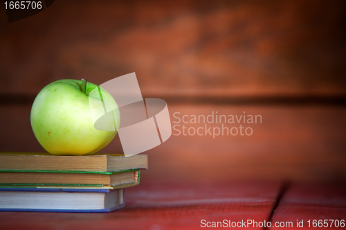 Image of Apple on pile of books