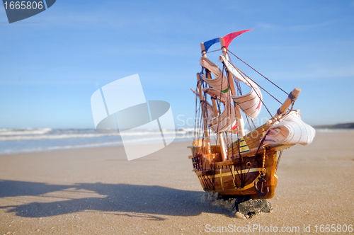Image of Ship model on summer sunny beach