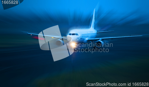 Image of Plane takes of at dusk