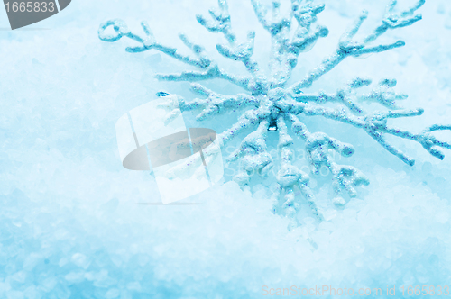 Image of Snowflake in snow. Christmas