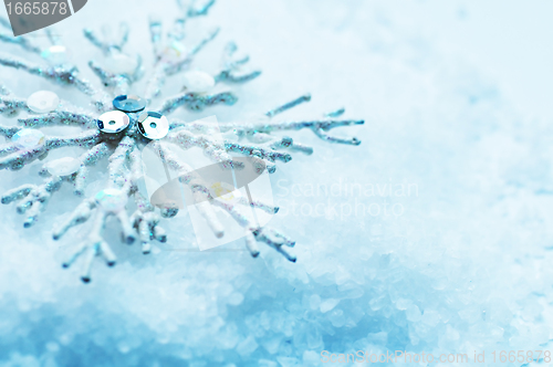 Image of Snowflake in snow. Christmas