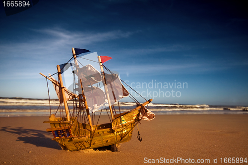 Image of Ship model on summer sunny beach