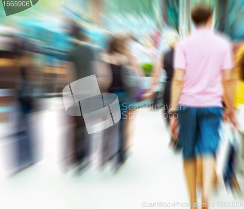 Image of People rush on crowded street