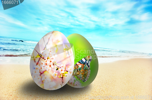 Image of Colorful easter eggs on sunny beach