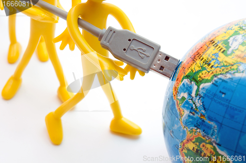 Image of USB plugs into earth. Conceptual