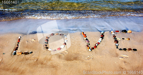 Image of Word LOVE on beach sand