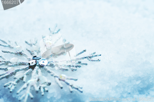 Image of Snowflake in snow. Christmas