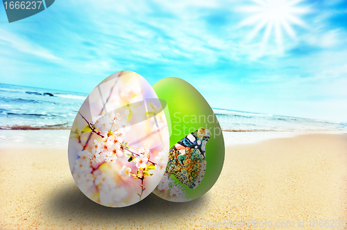 Image of Colorful easter eggs on sunny beach