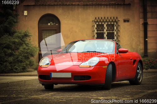 Image of Sport car in the old town scenery