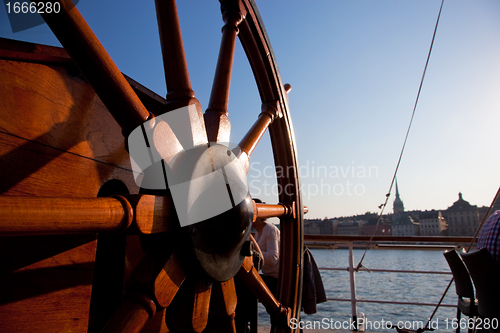 Image of Ship helm and a view on Stockholm, Sweden