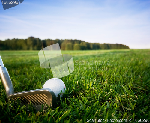 Image of Golf club and ball