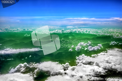 Image of High in the sky, puffy white clouds