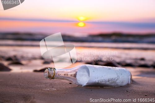 Image of Message in the bottle at sunset