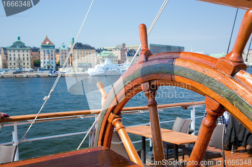 Image of Ship helm and a view on Stockholm, Sweden