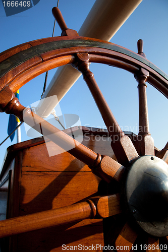 Image of Old helm, wooden wheel for navigation