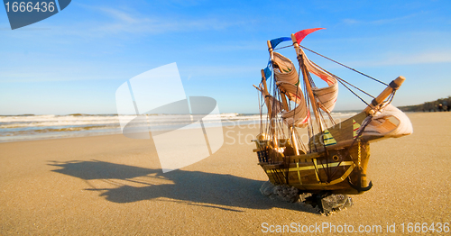 Image of Ship model on summer sunny beach