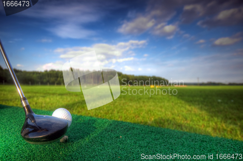 Image of Playing golf. Club and ball on tee