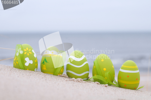 Image of Easter decorated eggs on sand