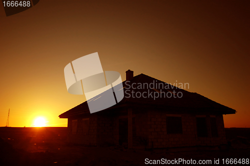 Image of Sunset silhouette of house