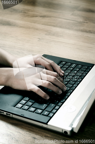 Image of Typing on laptop