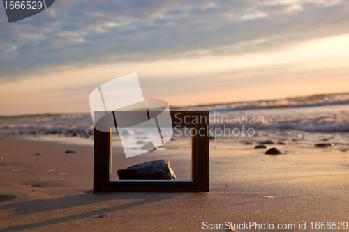 Image of Frame on the beach at sunset