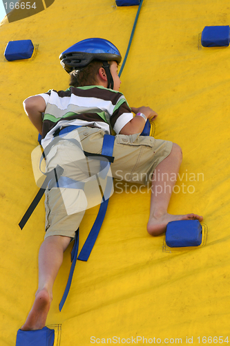 Image of Child climbing a climbing wall