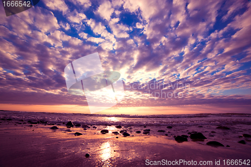 Image of Romantic sunrise over ocean