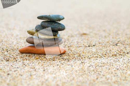 Image of Stack of stones on sand