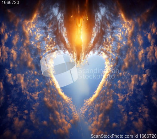 Image of Heart shape on sunset sky
