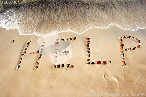 Image of Word HELP on beach sand