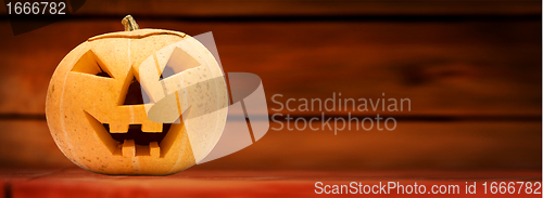 Image of Halloween pumpkin. Wooden background