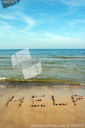 Image of Word HELP on beach sand