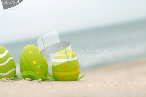 Image of Easter decorated eggs on sand