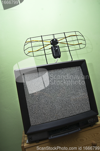 Image of Old TV set, noisy picture, aerial.