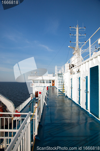 Image of Ship deck view, ocean in a sunny day