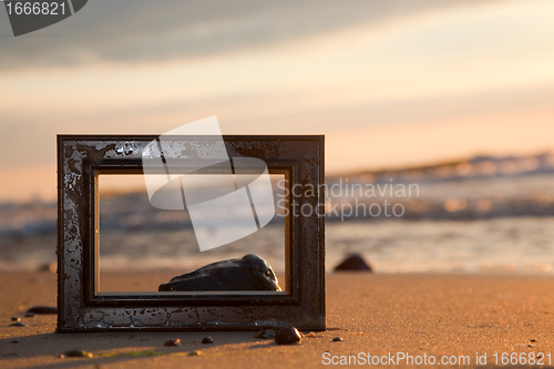 Image of Frame on the beach at sunset