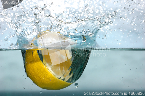 Image of Lemon splash into water