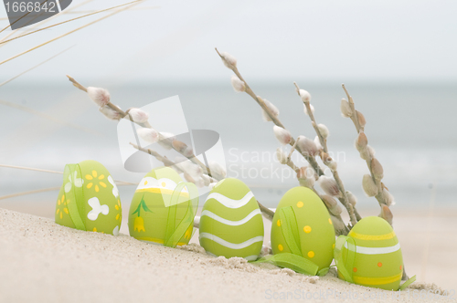 Image of Easter decorated eggs on sand