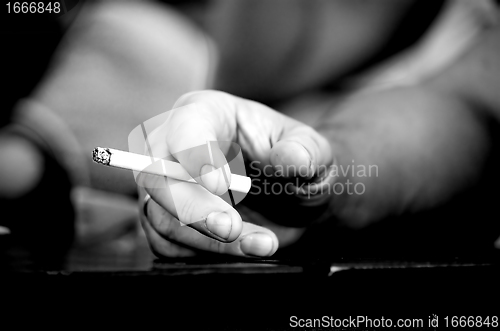 Image of Hand with cigarette