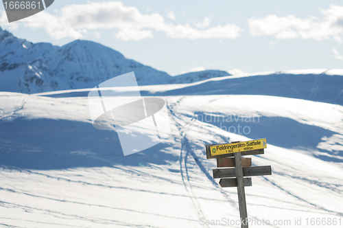 Image of The signpost in the winter mountains