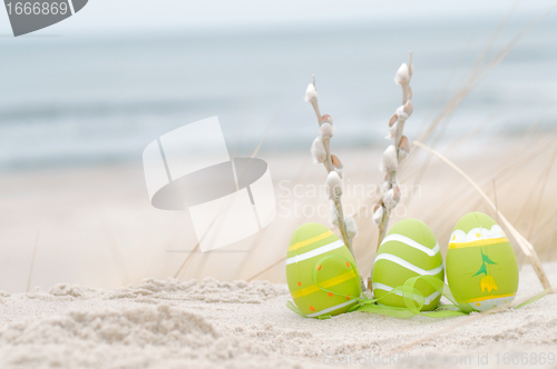 Image of Easter decorated eggs on sand