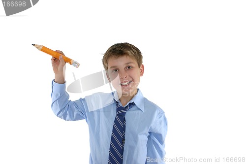 Image of Smiling schoolboy holding a pencil