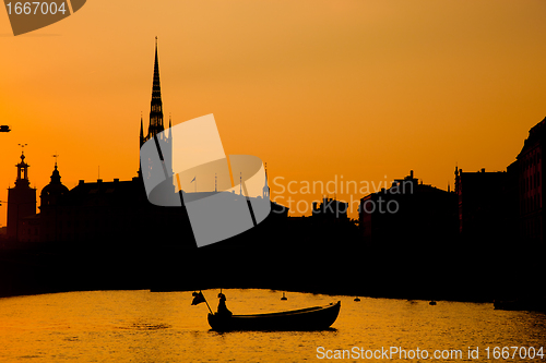 Image of Romantic Stockholm, Sweden. Boat at sunset