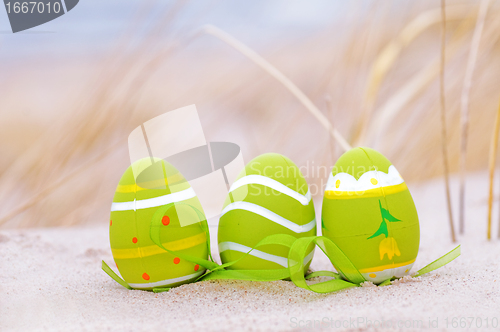 Image of Easter decorated eggs on sand